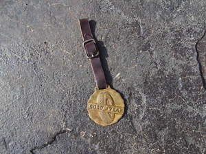 Vintage Goodyear Brass Molded Watch Fob with Original Leather Strap - Picture 1 of 7
