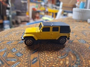 Jeep Wrangler Unlimited 2015 amarillo y negro diecast suelto coleccionable - Imagen 1 de 5