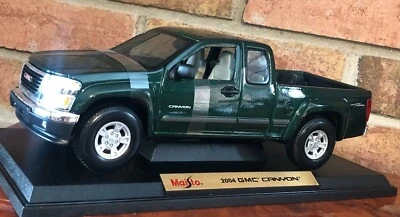 GMC CANYON 2004 DARK GREEN BRAND NEW FACTORY MAISTO SPECIAL EDITION  1:18 - Image 1 of 4