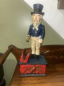 Banco de monedas mecánico de hierro fundido vintage del Tío Sam - Imagen 1 de 8