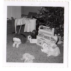 Vintage snapshot unhappy girl showing bottom Christmas tree toy doll iron board - Picture 1 of 2