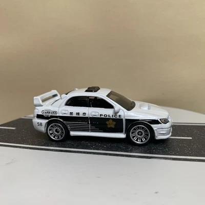 2024 Matchbox Police 2007 Subaru Impreza WRX Japan Cruisers White/Black 1:64 NM - Image 1 of 4