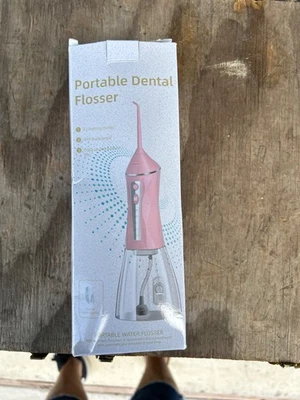Portable dental flosser NIB - Image 1 of 4