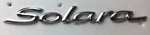 99 00 01 02 03 TOYOTA SOLARA TAPA PUERTA TRASERA EMBLEMA INSIGNIA SÍMBOLO LOGOTIPO OEM (2003) - Imagen 1 de 3