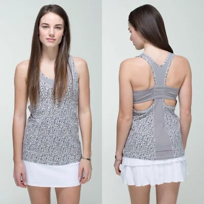 Camiseta sin mangas Lululemon Tone It talla 6 flor plata cuchara ambiental gris espalda deportiva Foto 1 de 4