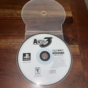 Street Fighter Alpha 3 (Sony PlayStation 1, 1999) Disco de juego solo grandes éxitos - Imagen 1 de 6