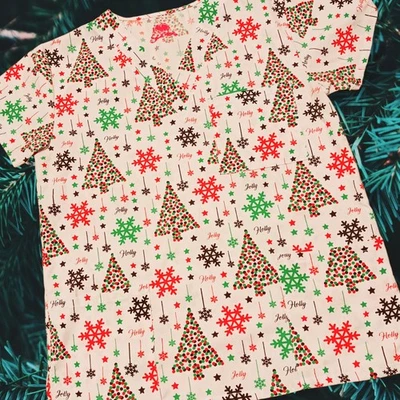 Scrubs Jolly Holly Snowflakes Christmas Trees Holiday Pockets Scrub Top Women’s - Image 1 of 3