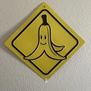 Universal Studios Hollywood Super Nintendo World Mario Kart Banana Peel Tin Sign - Picture 1 of 4