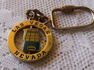 LAS VEGAS NEVADA LLAVE GIRATORIA MÁQUINA TRAGAMONEDAS *METAL* DOS CARAS - Imagen 1 de 4