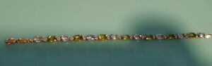 Peridot And Blue And White Topaz 10kt Yellow gold Bracelet  7 Inches