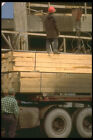 237083 Unloading Wooden Beams For Form Work A4 Photo Print