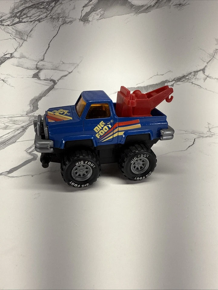 Camión monstruo Arco Big Foot 4x4 azul fundido a presión años 80 accionamiento por fricción camión de remolque de juguete Foto 1 de 4