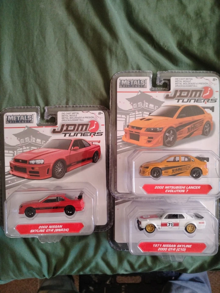 MITSUBISHI Lancer EVO 7 2002 sintonizadores JDM azules Jada Toys fundido a presión 1 64 Foto 1 de 1