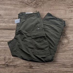 Pantalones de paracaídas American Eagle para hombre MT verde oliva nailon carga ceñido al tobillo nuevos con etiquetas - Imagen 1 de 6