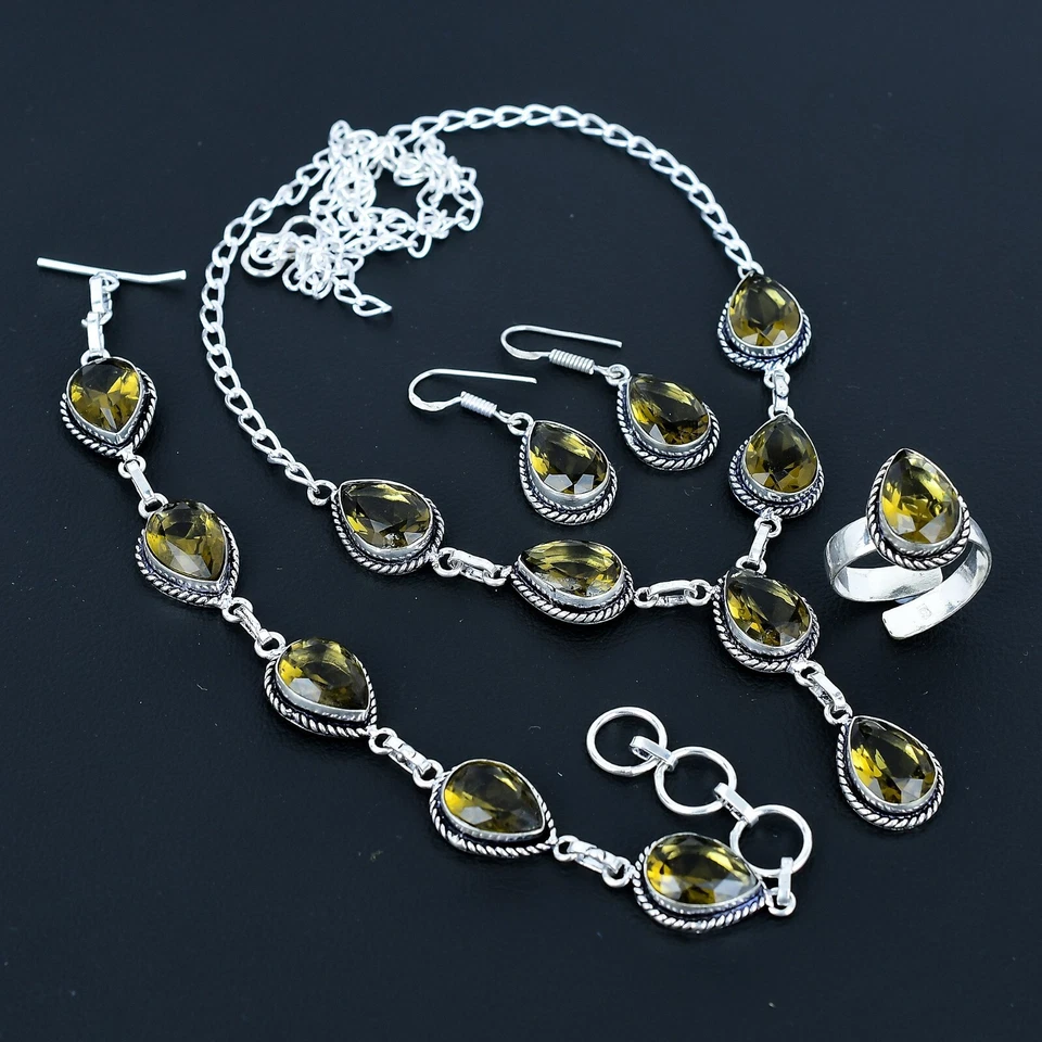 Juego de cuatro piezas de joyería de plata de ley 925 hecho a mano con piedras preciosas de topacio ahumado Foto 1 de 4
