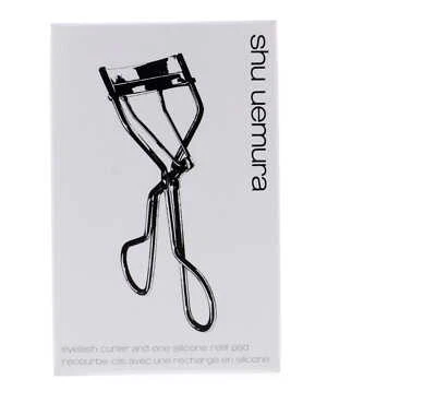 Rizador de pestañas Shu Uemura y una almohadilla de recarga de silicona Foto 1 de 4