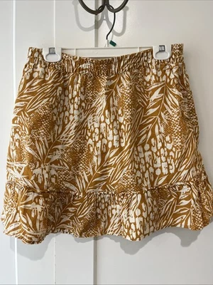 Falda de cintura elástica corta con volantes grandes de lino amarillo Christian Siriano para mujer Foto 1 de 4