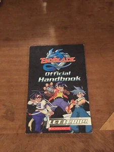 BEYBLADE- OFFICAL HANDBOOK- LET IT RIP- PAPERBACK - Imagen 1 de 3