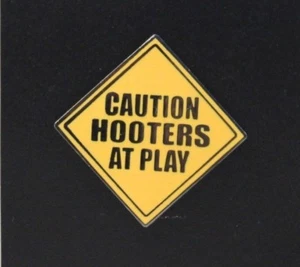 HOOTERS RESTAURANT COLLECTIBLE CAUTION HOOTERS AT PLAY ROAD SIGN LAPEL PIN - Picture 1 of 2