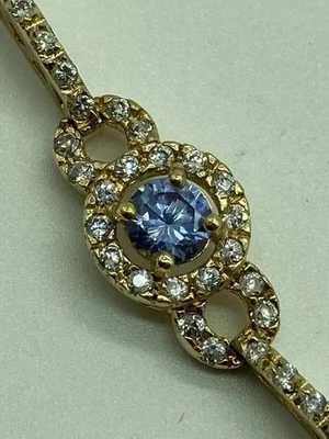 Brazalete de tenis para mujer de tanzanita simulada de corte redondo de 8 quilates enchapado en oro amarillo de 14 k Foto 1 de 4