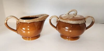 Vintage McCoy Light Brown Sugar Bowl With Lid And Double Handle and Creamer - Image 1 of 4