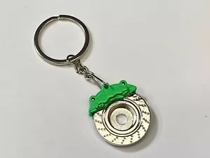 Llavero con almohadilla de ruptura de disco verde piezas de automóviles camión - envío rápido a EE. UU. - Imagen 1 de 7