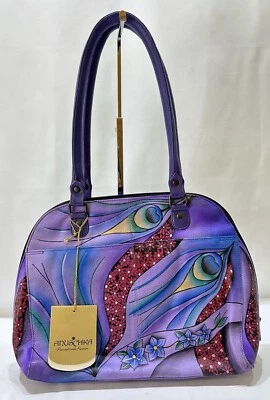 Bolso de mano Anuschka de cuero pintado a mano con cremallera alrededor estampado de plumas de pavo real Foto 1 de 4
