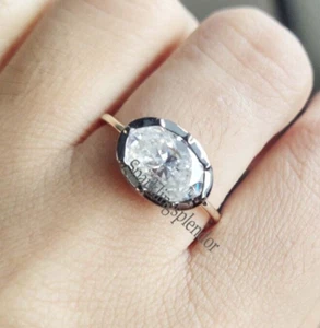 Anello di fidanzamento moissanite ovale est ovest lunetta rodiata nera set anello ovale lungo - Foto 1 di 12