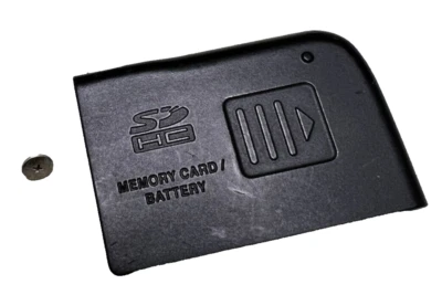 Panasonic DMC-FZ18 OEM PIEZA DE REPUESTO - Cubierta de puerta de batería negra Foto 1 de 3