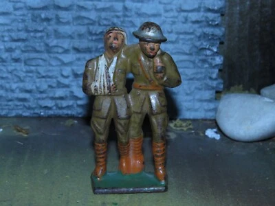 RARO TODO ORIGINAL GRIS HIERRO FUNDIDO JUGUETE SOLDADO AYUDANDO A HERIDOS-1930 Foto 1 de 4