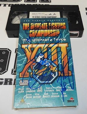 Guy Mezger Art Davie Tito Ortiz Enson Inoue Firmado UFC XVIII 13 VHS CERTIFICADO DE AUTENTICIDAD PSA/ADN Foto 1 de 4