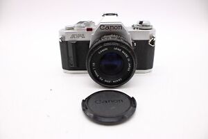 Appareil photo reflex argentique vintage F Canon AV-1 avec objectif et capuchon Canon FD 50 mm 1,8