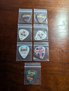 Def Leppard 7 Guitar Picks Authentic - Picture 1 of 4