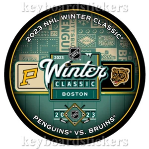 2023 WINTER CLASSIC DUELING HOCKEY PUCK BOSTON BRUINS VS PITTSBURGH PENGUINS - Picture 1 of 2