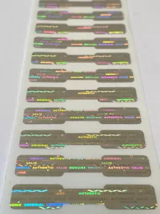 100 DOGBONE BRIGHT SILVER TAMPER EVIDENT VOID HOLOGRAM SECURITY LABELS STICKERS - Picture 1 of 3
