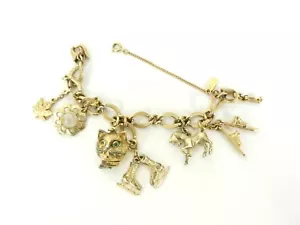 Monet GoldTone 6 Charm Bracelet Leaf Skates Snow Skis Horse Cat Flower S30E - Picture 1 of 9