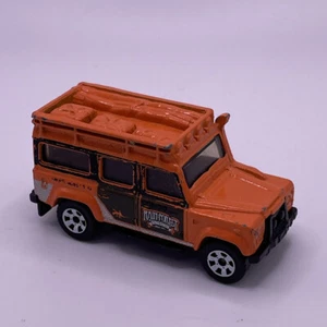 #72 - Land Rover Defender 110 - Orange. Matchbox 1-75 Series - Circa 2009 - Picture 1 of 5