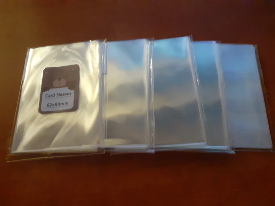 Lot de 5 paquets de 20 sleeves transparentes 62x89mm - Photo 1/1