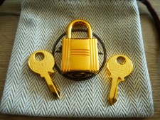 authentique cadenas hermès doré pour sacs a main kelly,birkin, neuf jamais servi
