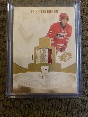 13/14 Upper Deck SPX Rookie Material Patches /75 #RM-EL Elias Lindholm Calgary  - Image 1 of 2