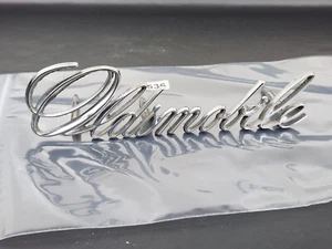 1971-72 OEM Oldsmobile Cutlass Script Grille Emblem 408950 0536 A9 - Picture 1 of 6