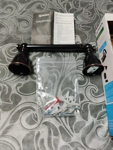 Moen Caldwell schwenkbarer Toilettenpapierhalter Stab mediterran Bronze  - Bild 1 von 5