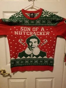 Elf Movie Will Ferrell Weihnachtspullover Medium Son Of A Nutcracker Größe LG - Bild 1 von 3