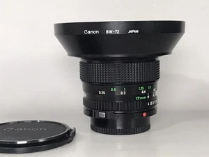 *EXCELENTE COMO NUEVO* Lente ultra gran angular Canon FD NFD 17 mm f/4 MF con capucha BW-72 - Imagen 1 de 16