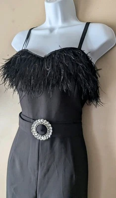 Mono negro con cinturón ribete de plumas Bebe talla 12 nuevo con etiquetas  Foto 1 de 4