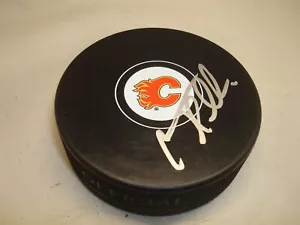 Jonas Hiller Signed Calgary Flames Hockey Puck Autographed 1B - Picture 1 of 2