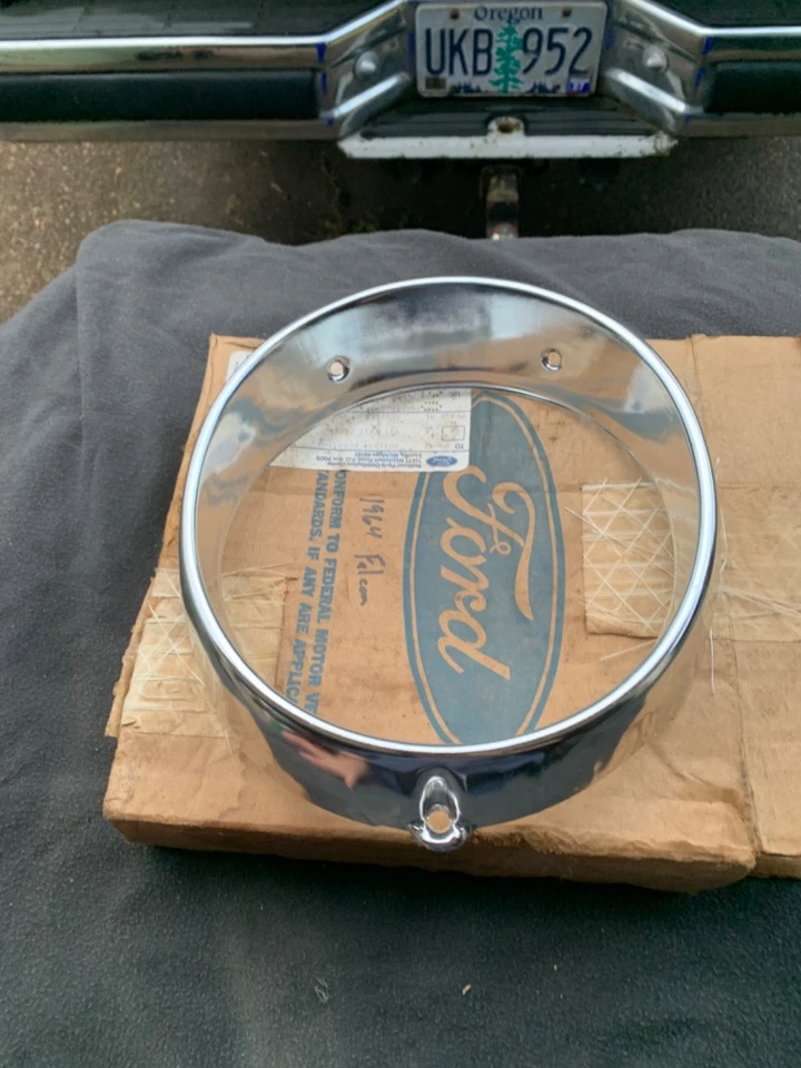 NOS OEM 1964 FORD FALCON  SPRINT,FUTURA,TUDOR,WAGON,RANCHERO HEADLIGHT  BEZEL - Image 1 of 4