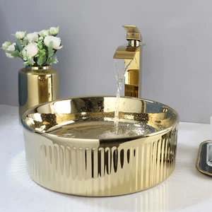 Juego de drenaje mezclador de lavabo de cerámica lavabo lavabo lavabo redondo dorado para baño - Imagen 1 de 10