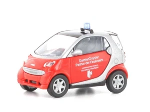 Busch 489310 Smart City Coupe Pompiere Nordrhein Westfahlen HO 1:87 NUOVO - Foto 1 di 1