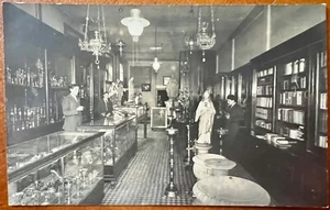 RPPC Interior of Lighting Store Lamps Candle Sticks Religious Statues Books Men - Picture 1 of 4